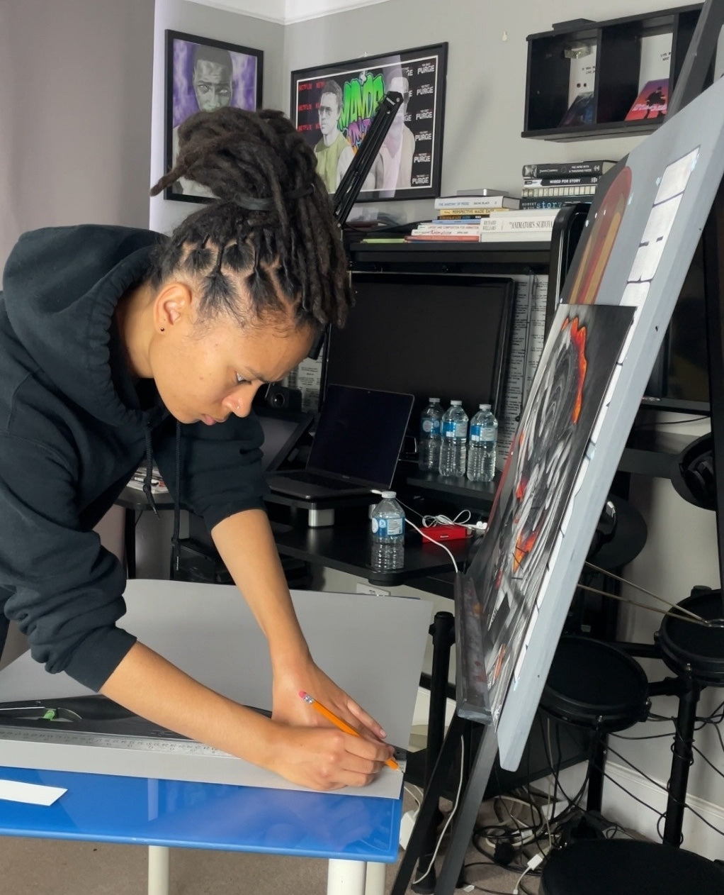Professional artist Naomi Richards drawing in her home art studio