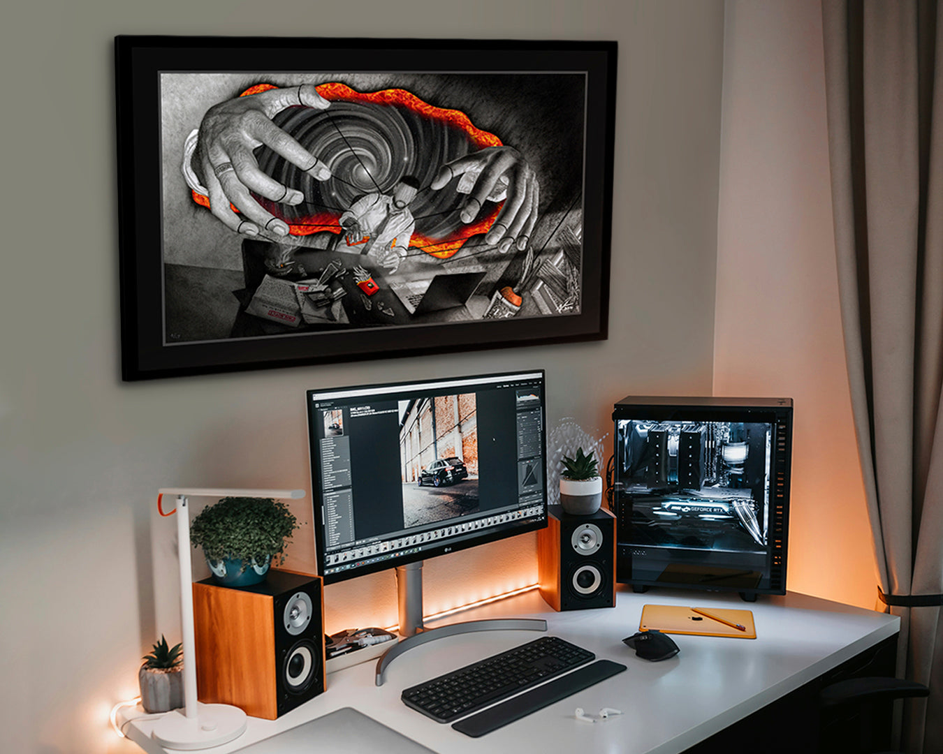 Collector’s Edition print of ‘At Your Command’ hanging above desk with PC, monitors, and speakers – entrepreneur artwork in workspace