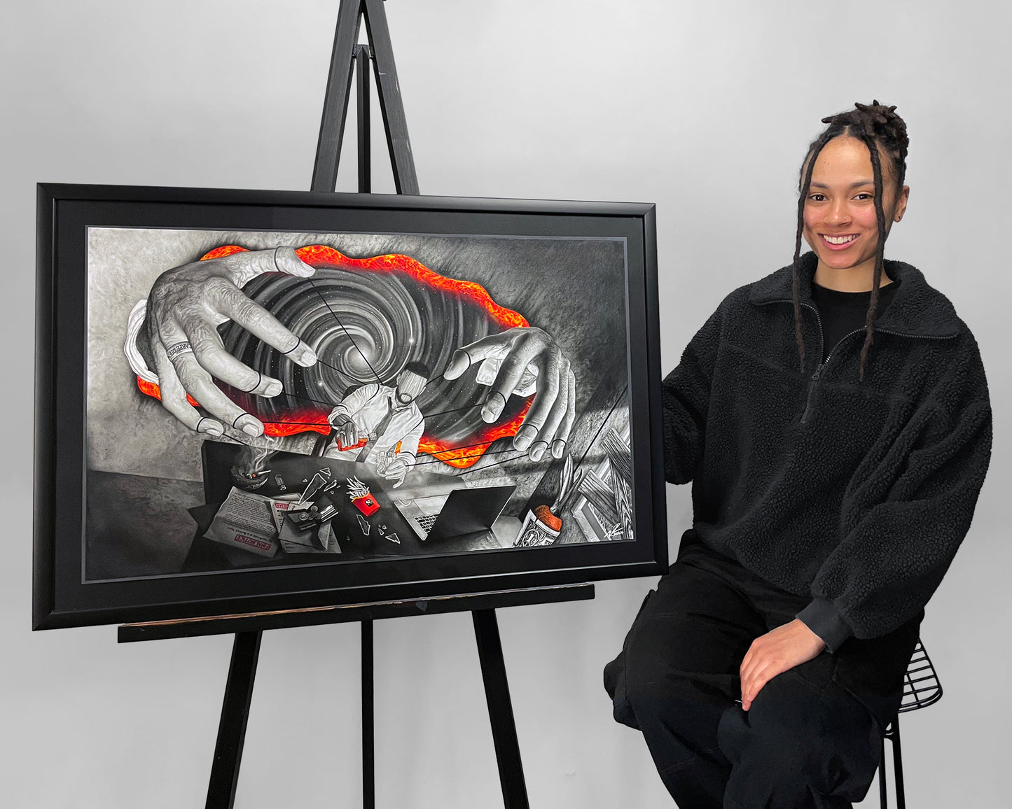 Visual Artist Naomi Richards sitting beside her framed original artwork ‘At Your Command’ – spiritual, metaphysical, esoteric art