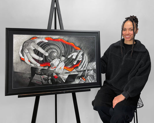 Visual Artist Naomi Richards sitting beside her framed original artwork ‘At Your Command’ – spiritual, metaphysical, esoteric art